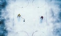 Couple Skiing Down Snow Covered Slope