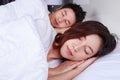 Couple sleeping on a comfortable bed in bedroom at home Royalty Free Stock Photo