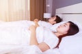 Couple sleeping on a comfortable bed in bedroom at home Royalty Free Stock Photo