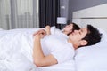 Couple sleeping on a comfortable bed in bedroom at home Royalty Free Stock Photo