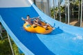 Couple sliding down a water slide Royalty Free Stock Photo