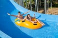 Couple sliding down a water slide Royalty Free Stock Photo