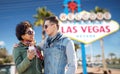 Couple with smartphone and earphones at las vegas Royalty Free Stock Photo