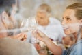 Couple, smile and champagne toast at dinner celebrating in home. Cheers, love and man, woman and sparkling golden wine Royalty Free Stock Photo