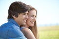 Couple, smile and hugging in nature, love and care in relationship on outdoor date. Happy people, embrace and relax on Royalty Free Stock Photo