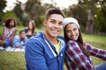 Couple, smile and portrait with love in park for bonding and fun on campus outdoor. Students, grass and happy together Royalty Free Stock Photo