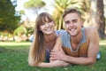 Couple, smile in portrait and relax on grass in park, love and commitment in healthy relationship with picnic outdoor