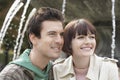 Couple Smiling In Front Of Fountain Royalty Free Stock Photo