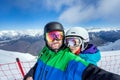 Couple snowboarders doing selfie on camera