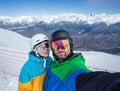 Couple snowboarders doing selfie on camera