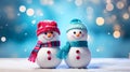 Couple Snowman standing outside on a winters day. Concept of winter, snow and childhood