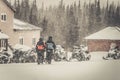 Couple on a snowmobile in the woods Royalty Free Stock Photo