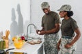 Couple of soldiers cooking together