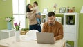 Couple and son taking care of son working at home Royalty Free Stock Photo