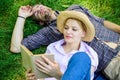 Couple soulmates at romantic date. Couple in love spend leisure reading book in park. Family enjoy leisure with poetry Royalty Free Stock Photo