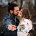 Couple with sparklers. Hipsrer couple kissing. Square format