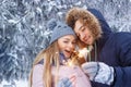 Couple with sparklers in winter Royalty Free Stock Photo