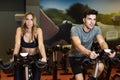 Couple in a spinning class wearing sportswear. Royalty Free Stock Photo