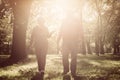 Couple in sports clothing walking trough park together an Royalty Free Stock Photo