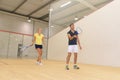 couple with squash rackets indoor training club Royalty Free Stock Photo