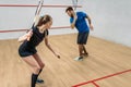 Couple with squash rackets, indoor training club Royalty Free Stock Photo