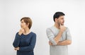 Couple standing with arms crossed and thinking something Royalty Free Stock Photo