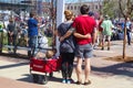 Couple standing back to camera with arms around one another and two children in wagon at March for Life protest in Tulsa Oklahoma