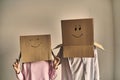 Couple in boxes in new house. Young happy couple with cardboard boxes on their heads happy their new home Royalty Free Stock Photo