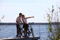 Couple standing on bridge by the lake Royalty Free Stock Photo