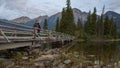 Couple standing on a bridge romantically looking out with beautiful landscape