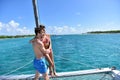 Couple standing in catamaran cruising in caribbean sea Royalty Free Stock Photo