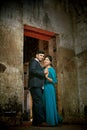 a couple is standing in the doorway of an old building