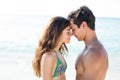 Couple standing face to face with eyes closed at beach Royalty Free Stock Photo