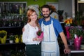 Couple standing with flower bouquet Royalty Free Stock Photo