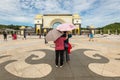 Couple standing in front of the Gate of Royal Palace Istana Negara Istana Negara, Kuala Lumpur, Malaysia