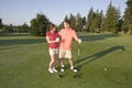 Couple Standing on Golf Course - Horizontal Royalty Free Stock Photo