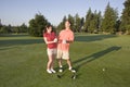 Couple Standing on Golf Course - Horizontal Royalty Free Stock Photo