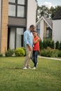 Couple standing outside near their cottage house at the weekend Royalty Free Stock Photo