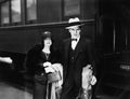 Couple standing at a railroad station platform Royalty Free Stock Photo