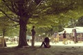 Couple standing on a tree shade at Waha Festival