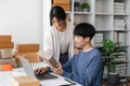 Couple startup small business working with laptop at workplace. freelance man and woman seller check product order Royalty Free Stock Photo