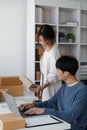 Couple startup small business working with laptop at workplace. freelance man and woman seller check product order Royalty Free Stock Photo