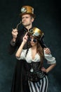 The Couple Steampunk. A Man With A Pipe And A Girl With Glasses