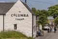 Couple stop for refreshment outside a hotel on the Isle of Iona, Scotland, UK