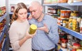 Couple holding preserved goods Royalty Free Stock Photo