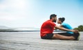 Couple, stretching and legs in exercise at beach to start fitness, training or outdoor with blue sky mockup. Workout Royalty Free Stock Photo