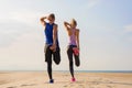 Couple stretching legs before workout Royalty Free Stock Photo