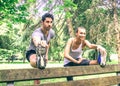 Couple stretching in park