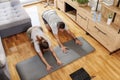 Couple stretching while working out at home Royalty Free Stock Photo