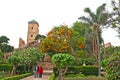 Couple strolling through the Andalusian Gardens at the edge of t
